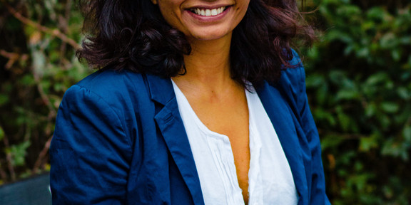 A portrait of a woman, who is the speaker of the seminar